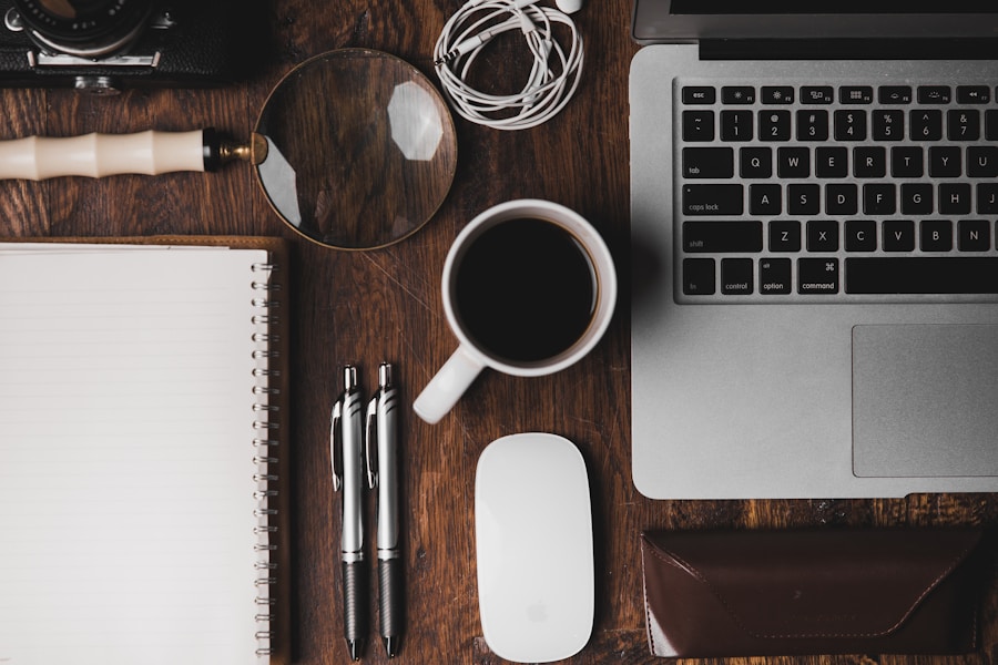 A laptop and other objects on a table.