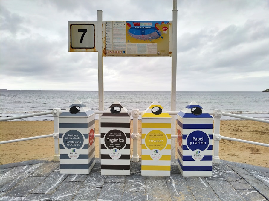 Three trash cans on the beach.