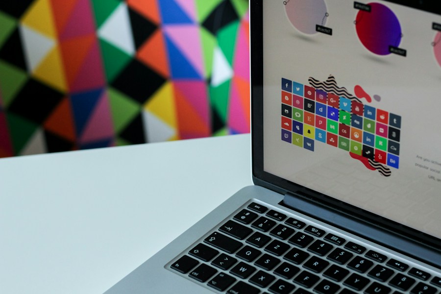 A laptop is displaying a colorful pattern on the screen.