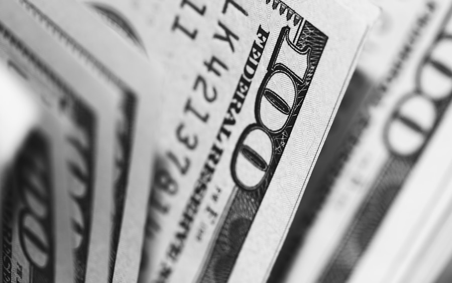 Close-up of us dollar bills in black and white with selective focus.