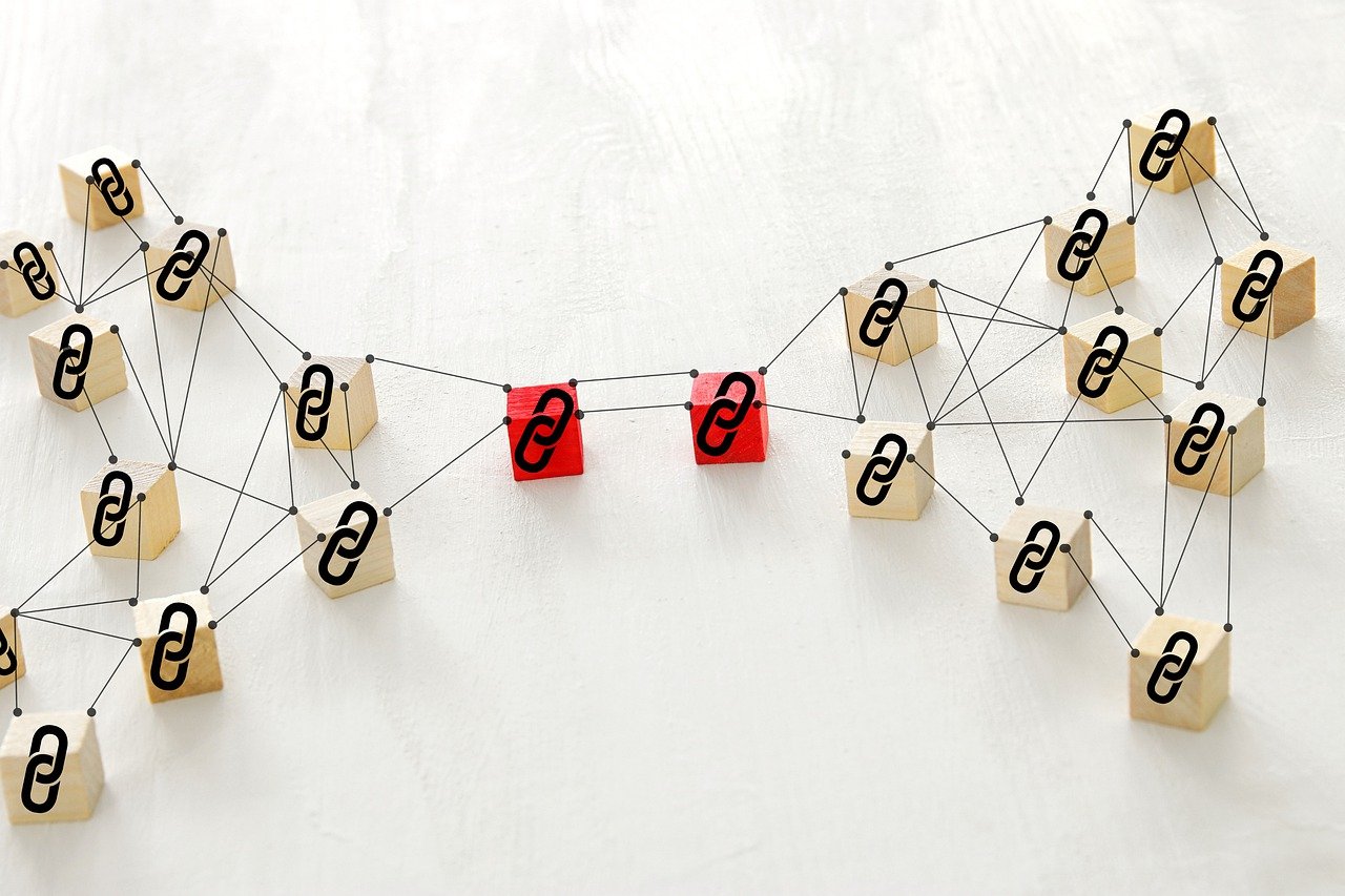 Network of connected blocks with black question marks, featuring two central red blocks with white question marks and easy-to-rank backlink tactics, set against a white background. depicting easy-to-rank backlinks tactics