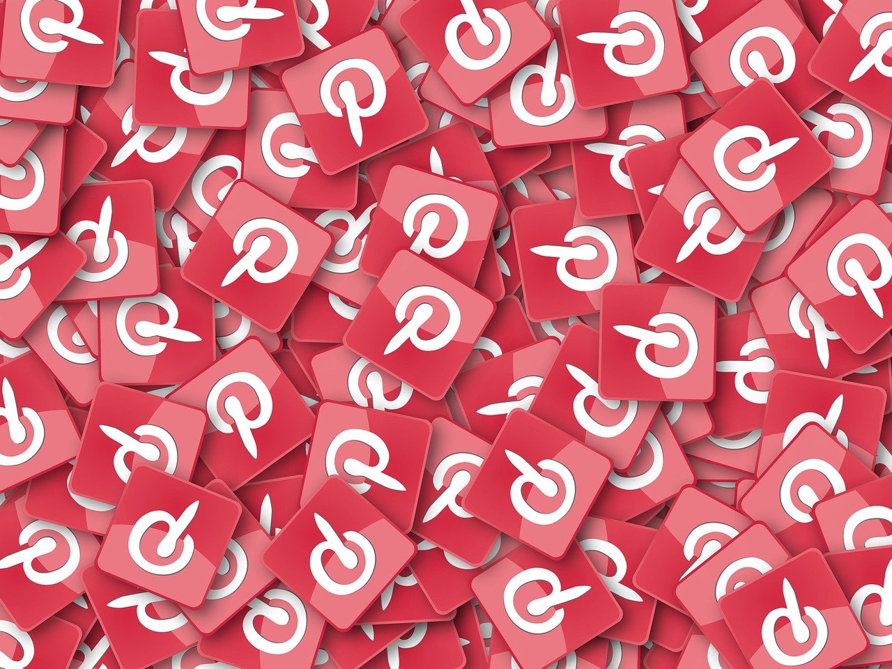 A large number of pinterest logo icons scattered across the frame depicting the ultimate pinterest strategy for affiliate marketers