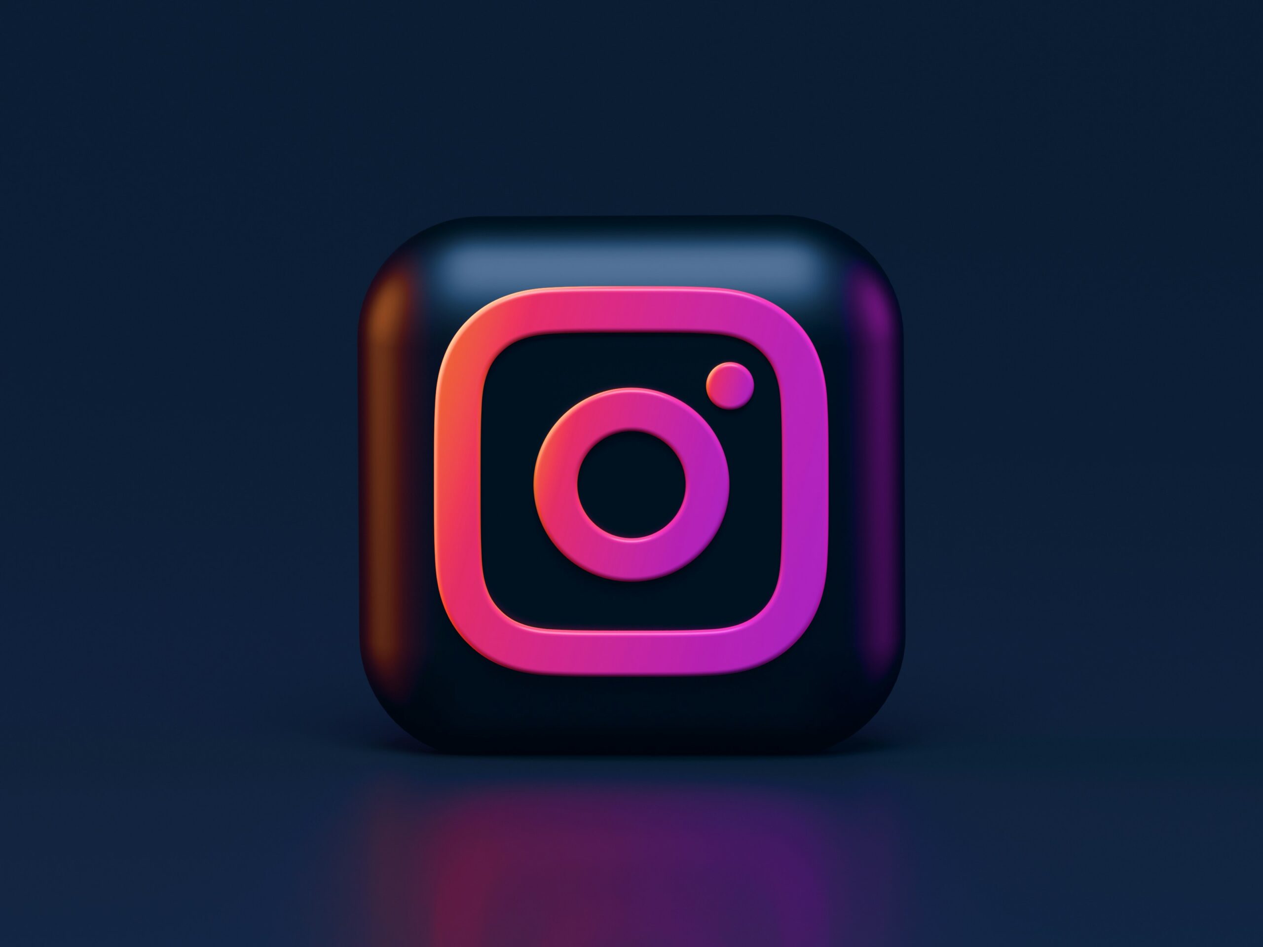 3d rendering of the instagram app icon glowing in pink and purple hues on a dark background depicting instagram's shopping feature for affiliate marketing