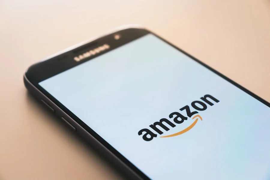 Smartphone on a table displaying the amazon logo on its screen, bathed in soft light depicting amazon affiliate marketing on instagram