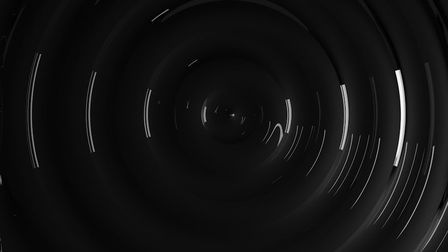 A dark, abstract image with concentric circles and scattered white light reflections creating a sense of depth and movement.