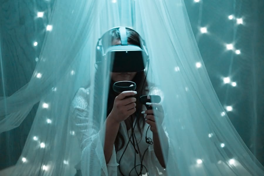 Person wearing a VR headset and holding controllers, sitting under sheer curtains illuminated by small lights.